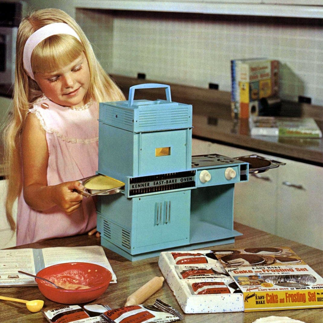 A Girl With Her Old Style Easy-Bake Oven